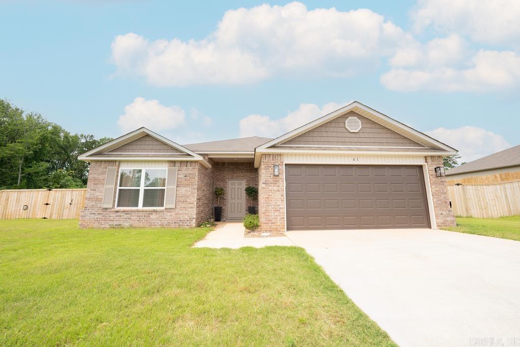 This is a 4 bed, 2 bath located on a sizable lot, in the heart of the coveted Oakland Grove Estates of Austin, Arkansas. Inside you're welcomed to your large living area with ample, natural light, LVP flooring throughout, and a fireplace thats sure to turn heads. Open to the living area is access to your spacious kitchen/dining, with a beautiful island thats great for breakfast or entertaining. To the right of the living area, you'll find your privately placed master suite with shower/tub combo, water closet, and walk in closet. Head back through the front hallway to find your primary bath, 3 additional bedrooms, laundry, and access to your spacious two car garage. Weāre so excited for you to come see if itās yours. 61 Dunnaway Drive. Welcome Home.