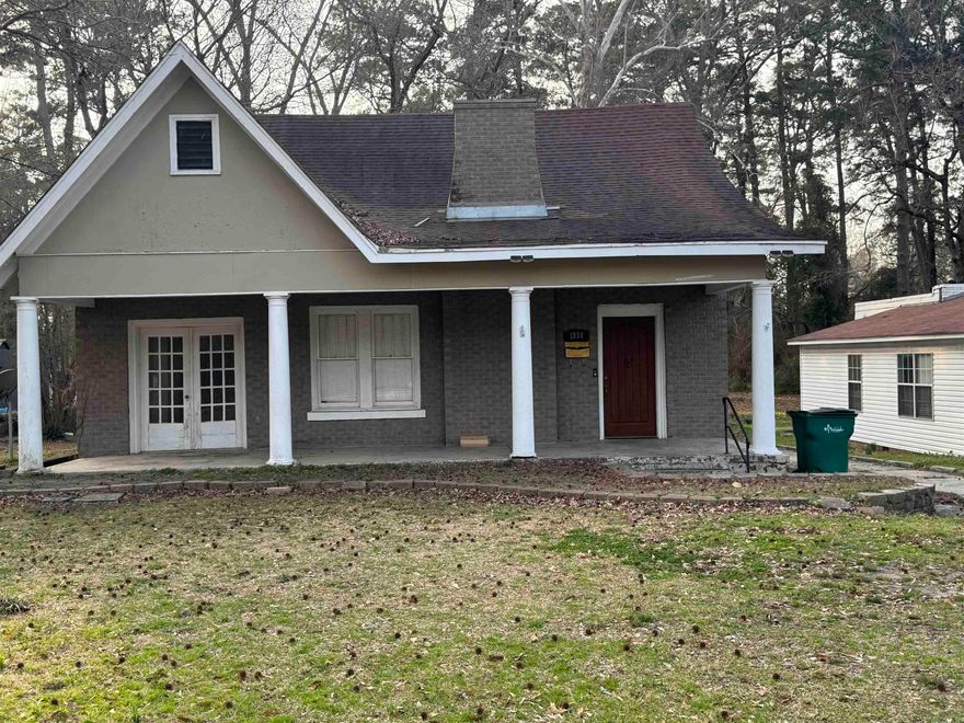 Charming and conveniently located 3-bedroom 2.5 bath home offers space, character, and opportunity for investors or first-time home buyers. This older home is being sold-as, where-is but with little TLC could be move in ready. Inside you will find a spacious eat-in kitchen, separate dining area, and a large living area. Separate laundry area, generously sized bedrooms, front and back porches.   Taxes, square footage, and lot dimensions taken from courthouse records. Unknow exact age of home. No property disclosure available.