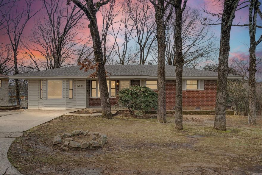 Fully renovated 3 bedroom, 3 full bathroom home located in the established Indian Hills subdivision of North Little Rock.  Recent updates include a new roof, luxury vinyl plank (LVP) flooring, quartz countertops throughout, updated primary ensuite bath, and a new back deck.  The open-concept main level offers flexible living and dining arrangements for both formal entertaining and casual everyday living, along with space for a true eat-in kitchen. Abundant natural light fills the home, and dimmable lighting in nearly every room allows for bright task lighting or relaxed evening ambiance.  The lower level features a private bedroom and full bathroom with direct access to the back patio—ideal for multigenerational living, in-law quarters, guest suite, home office with private entry, or teen retreat. A spacious den/bonus room provides additional flexible living space.  The backyard offers a low-maintenance setting and blank canvas for future landscaping, garden design, or outdoor living enhancements.  Conveniently located near Burns Park recreation amenities, including golf, trails, playgrounds, and the Burns Park Family Aquatic Center, with easy access to it all. Move in ready.