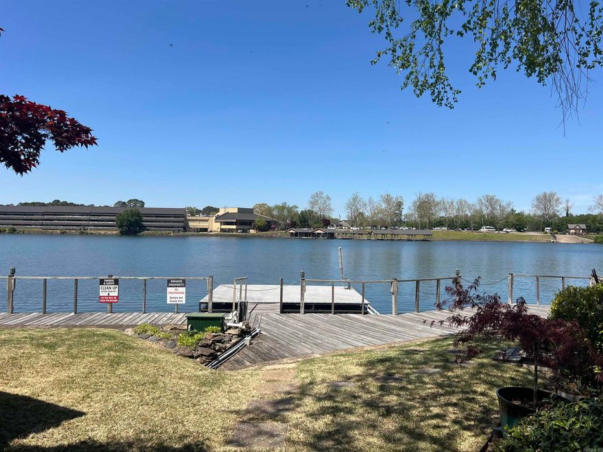 DEEDED BOAT SLIP INCLUDED: 2nd floor condo on Lake Hamilton and only 5 miles from Oaklawn Racing Casino Resort. This 2bed/2bath property has been completely updated: New LVP flooring, light fixtures, granite countertops and paint through out, new stove and dishwasher and a custom tiled shower in the master. The two wood burning fireplaces located in the living area and primary bedroom and the close proximity to the properties swimming pool will make this condo enjoyable in all seasons. Please note: No nightly rentals permitted