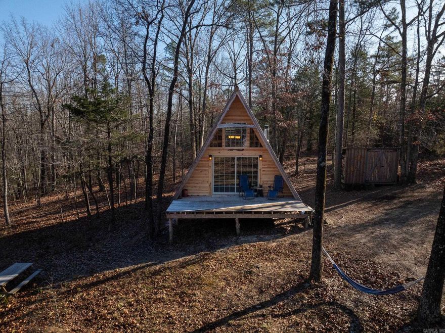 The Concord 30 is a truly rare find!  This property features a beautiful 1-bedroom, 1-bath, hand-crafted A-Frame style home situated on 30 acres, complete with a natural spring, and is located at the end of a county road. The home showcases excellent wood craftsmanship throughout, a cozy wood-burning fireplace, and a woodshed with storage for an off-grid water system. City water is also nearby and can be connected, and the home is already served by electricity. It is perfect as a weekend retreat or a permanent residence for a small family with room for expansion.  The land includes a well-maintained trail system that leads to food plots, an old grove of Black Walnut trees, and the natural, year-round spring located in the heart of the property. Backing up to hundreds of acres of private land, the property offers exceptional privacy for both you and the thriving local wildlife, including deer and turkey.  For serious outdoor enthusiasts, the Concord 30 is conveniently located near multiple public access areas and WMAs, including:  Cherokee WMA (15 min) Fouchee Cave Natural Area (16 min) Little Red River (22 min) Jim Kress WMA, Greer's Ferry Lake, and Sugar Loaf Mt. (25 min)