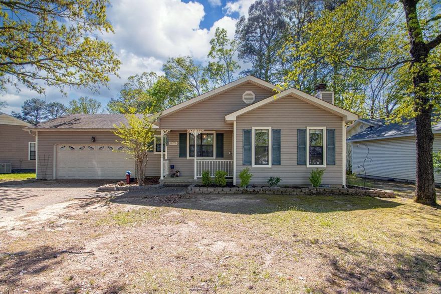Nestled in the established Timber Ridge neighborhood of Little Rock , this inviting 3-bedroom, 2-bathroom traditional home is a fantastic find. Sitting on a level 0.18-acre lot , the property features a fully wood-fenced backyard complete with a spacious deck creating the perfect private oasis for weekend relaxing or entertaining. Inside the approximately 1,355 square foot, single-story layout, you will find all three bedrooms conveniently located on the same level. The living areas are accented by easy-to-maintain laminate flooring , along with a cozy site-built, wood-burning fireplace equipped with gas logs. Featuring a kitchen/dining combo, plus connections for both gas and electric ranges. The home's exterior boasts easy-care metal/vinyl siding and an architectural shingle roof with full guttering. Complete with a two-car garage, central air and gas heating, and a dedicated laundry room, this home offers a peaceful retreat just minutes away from shopping, dining, and entertainment near Chenal Parkway and West Markham Street.