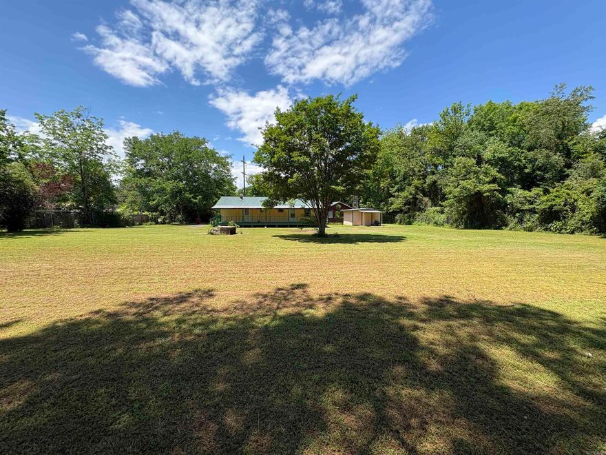 Cozy 3 bed, 1 bath home with a well-maintained interior, new kitchen cabinets and countertops and all laminate flooring for easy cleaning. Great outdoor spaces with the spacious yard area. Perfect for garden spots and an outdoor building for extra storage. Covered front and back porches. A little slice of country living while just inside city limits. Seller elects to sell AS IS!!