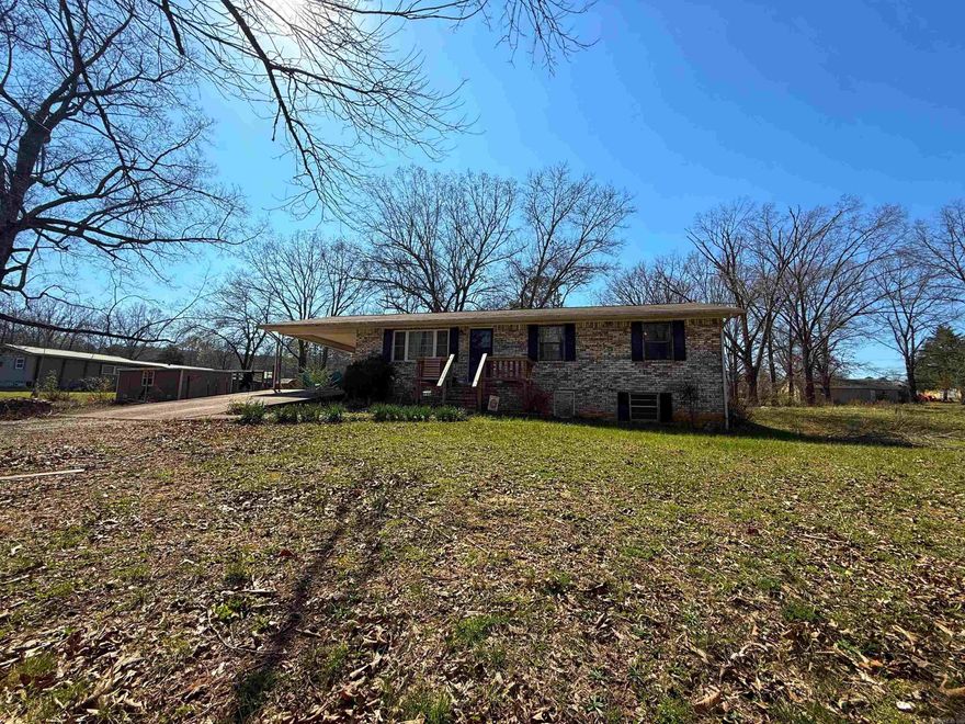 Sitting near the Calico Rock line, this well-maintained 3 bedroom, 1 bathroom all-brick home offers a peaceful country feel on a beautiful shaded 2-acre lot with mature hardwoods. Enjoy the convenient location near historic downtown Calico Rock, the White River, and Norfork Lake. Inside, you'll find a functional floor plan with a dedicated laundry room, along with recent updates that include a tankless gas water heater and an updated bathroom with a new vanity and toilet. Outside features include a carport, fenced backyard for the pups, an additional storage building/workshop, and a basement area with a garage door that would make an ideal workshop, hobby space, or extra storage!