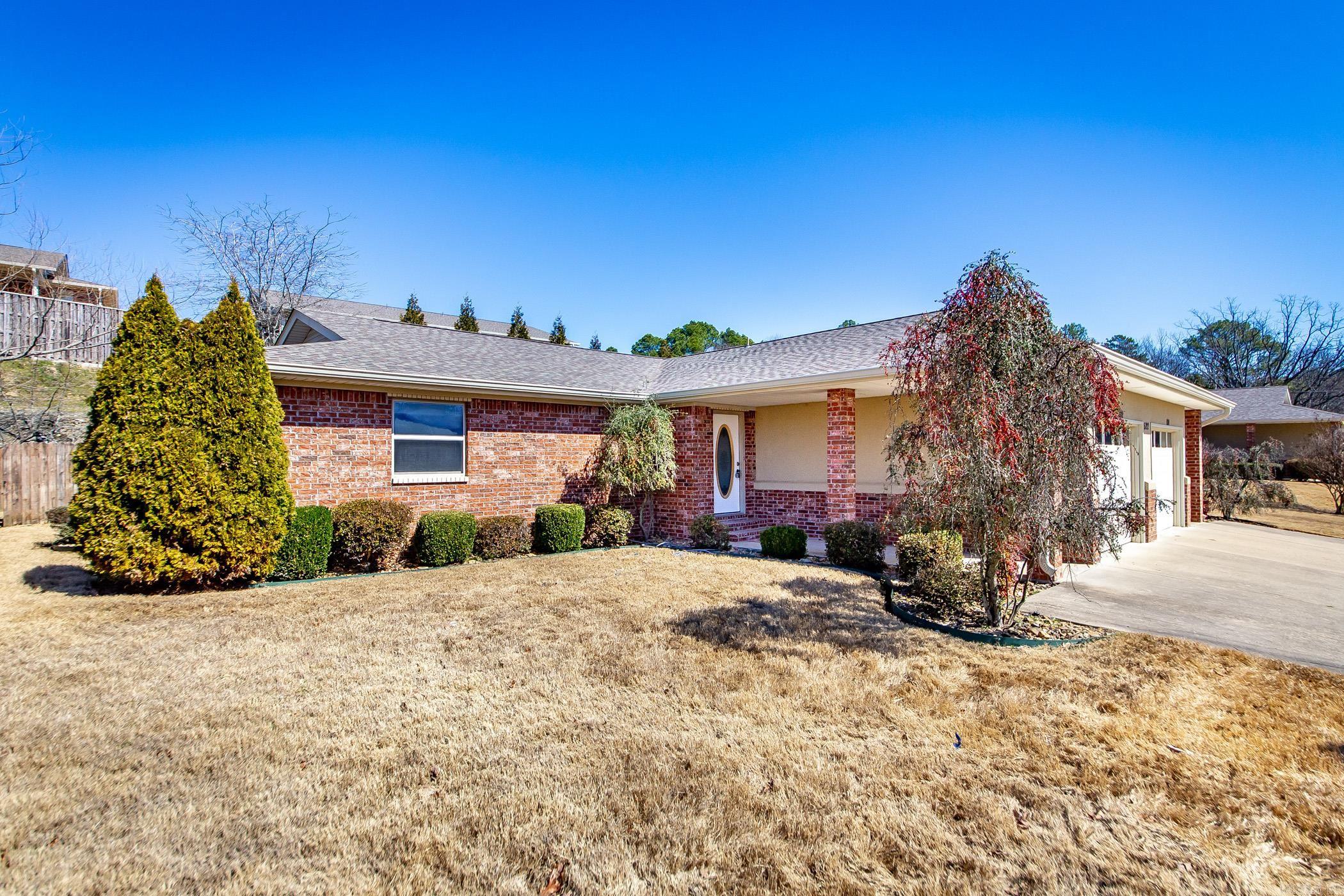 Enjoy all that Hot Springs has to offer from the comfort and ease of this one level condo located near the lake! Enjoy maintenance free luxuries with POA maintained pool, lawn, and a gated entry for added security. This functional home boasts brand new flooring, trim work, and paint throughout. Each bedroom features access to its own full bathroom. Along with an open living space and kitchen area, this functional home offers stainless steel appliances, a laundry room, fenced and paved patio area, and additional storage space in the back of the home. It also features an in unit laundry room with built in storage and one car garage. All this and so much more make this a perfect solution for anyone seeking to own in Hot Springs desiring one level, low maintenance living, and desiring proximity to the lake. Roof, exterior of home and landscaping managed by POA.