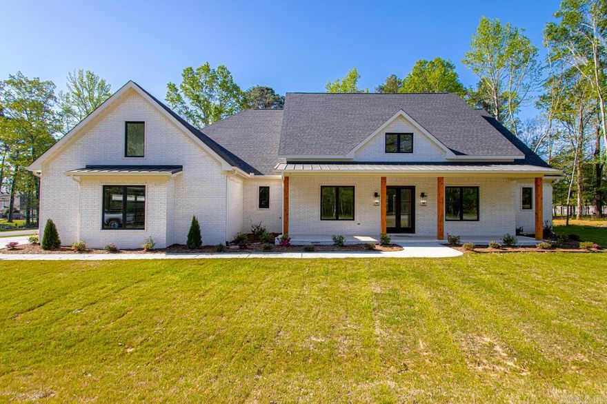 WOW... PICTURE PERFECT NEW CONSTRUCTION CUSTOM HOME!!! Amenities include: Approximately 3835 square feet, 5 Bedrooms, 4 1/2 Bathrooms, 5th bedroom/bonus room, Living Room with Gas Log Rock Fireplace, Open Floorplan, Wonderful Kitchen with Large Kitchen Island, Breakfast Bar, Large Walk-in Pantry, Large Primary Bedroom with double walk-in closets, Primary Bathroom is exquisite with Double Vanities and double toilets separated by Walk Thru Shower to give each person their own privacy, Office Room, Large Laundry with sink and ample cabinetry, Bonus Room/5th Bedroom has its own Full Bathroom and Walk-In Closet, Large Front Sitting Porch, Huge Covered Patio, Nice Tree Shaded 1 acre Lot, 3 Car Side Load Garage, Bryant Schools, And Much More... A Must See.... Truly a Custom Built Home....