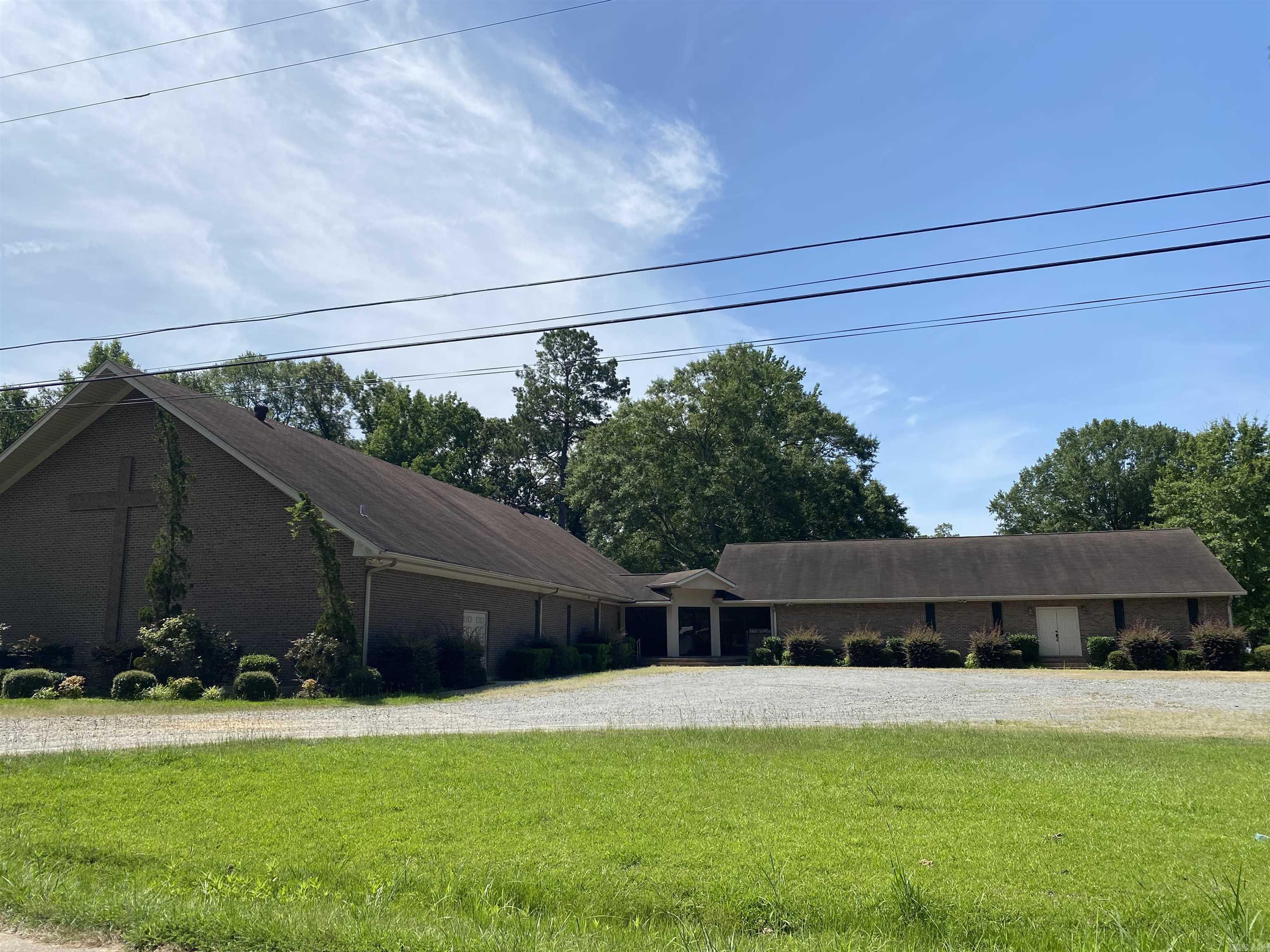 Beautifully updated building that was once home to Freedom Ministries. Originally constructed in 1975 the Fellowship Hall, kitchen and bathrooms were added in 2004. Listing includes building, land, outbuildings and extra vacant lot. All furniture, inventory, supplies and equipment to be negotiated separately. Pre-Approval or Proof of Funds statement required prior to showing.