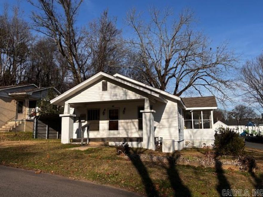 Built in the era of gracious living this home, with its charming front porch and original hardwood floors, should be on your "must see"  list. Built with separate dining room and very large living room and sunroom, it will fit many lifestyles. It sits on a landscaped corner lot, fenced on sides and back, just one block off of Central/Park. Easy parking with generous off-street parking with covers both front and back. A whole house generator is in place for comfort in case of power outages and in back is large detached building, divided into 2 sections, for hobbies or workshop.