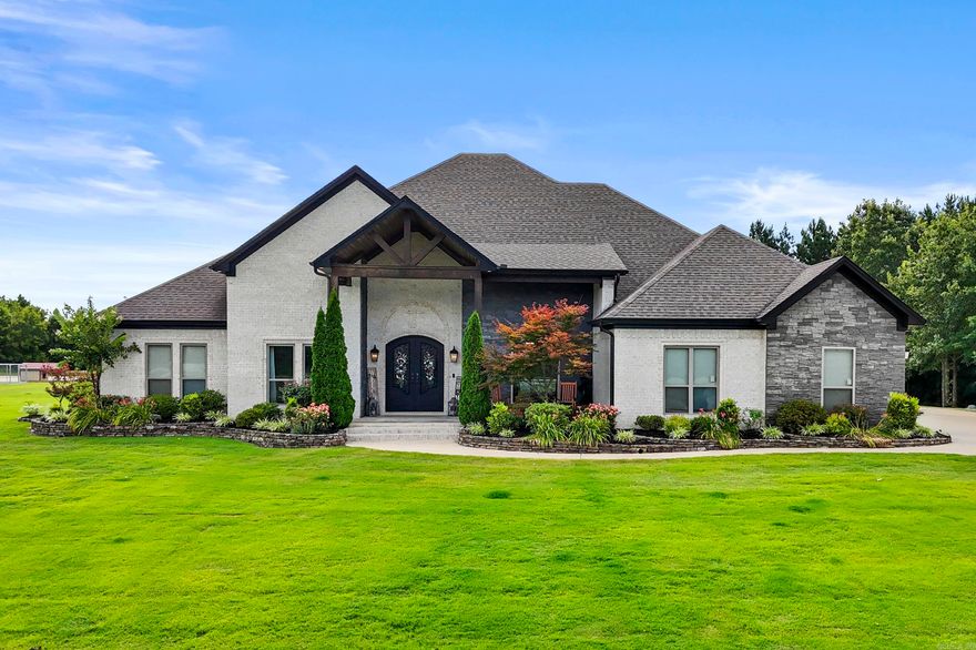 Luxury Country Estate on 50 Acres in West Searcy! Custom 3,375 SF one-level home with 14’ ceilings, wood beams, quartz countertops, 5x8 safe room, office/flex space, and a walk-through laundry connected to the primary closet. Chef’s kitchen features a custom vent hood to the ceiling, quartz countertops, gas cooktop, pot filler, double wall oven, built-in microwave, large island, pantry, breakfast area, and formal dining. Resort-style L-shaped saltwater pool with fountains and lighting, spacious patio, basketball and volleyball courts, walking/biking trails, food plots, and abundant wildlife. Oversized 2-car garage + separate 1-car garage with tankless water heater, ice maker, and generator wiring. Large shop with separate drive and parking lot—ideal for business use. Smaller pond at the front and a 7-8 acre pond/lake in the back currently under construction and to be completed by Seller prior to closing. Gated brick entrance with black steel fencing across the front for added privacy and curb appeal. Sprinkler system covers the landscaping and yard surrounding the home. Private, stunning, and built for entertaining!