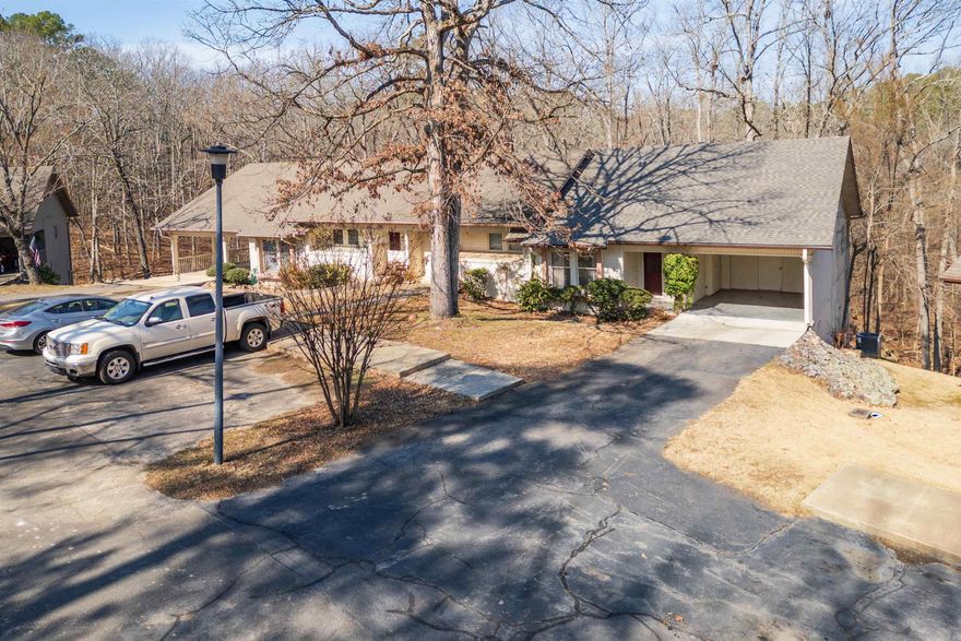 Great lake views in this updated 3-bedroom, 2 bath-townhome located in Coronado Courts.  The property is designed for easy living which includes all your daily needs located on the main floor - see attached floor plan.  Features include a spacious primary suite that connects to a modern bathroom; beautiful fireplace adds comfort to the living room; the remodeled kitchen includes granite countertops and stylish new cabinetry; breakfast and dining area; a sunroom with views of Lake Coronado and lots of natural light; and a covered deck to relax on. Refrigerator, washer and dryer convey with purchase.  Downstairs are two private guest bedrooms and full bath for visiting friends, family, or a flexible home office space.  An attached carport with a storage room adds everyday convenience, and a new roof installed February 2026 offers added peace of mind.  Hot Springs Village amenities include 11 scenic lakes; 9 championship golf courses; more than 30 miles of hiking trails; pickleball and tennis courts; state of the art fitness center; indoor and outdoor swimming pools; and more!  Come see all that this low-maintenance property has to offer!  See Agent Remarks for additional details.