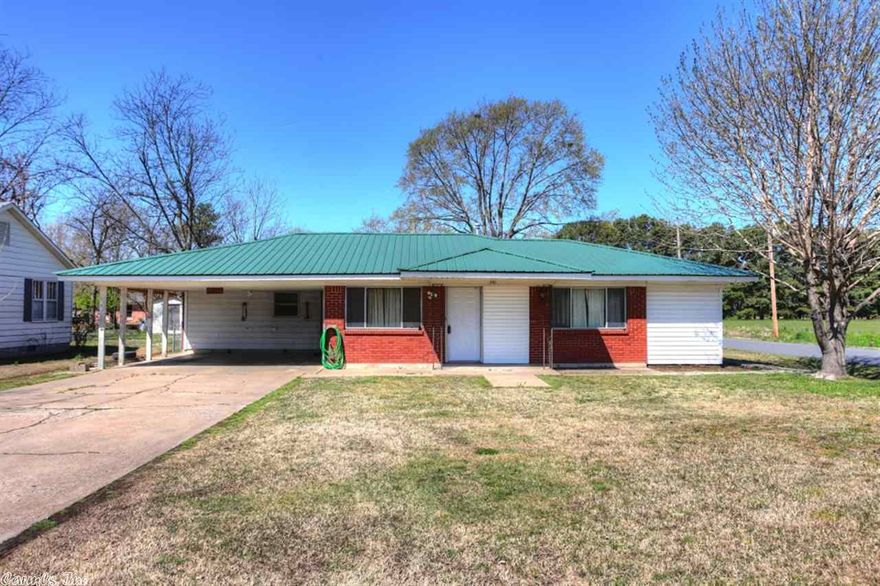 Perfect for the growing family!  Spacious kitchen & Huge dining room...perfect for large family gatherings!  Huge extra bedrooms...room to sleep, play, and do homework!  Mom will love master bedroom with office/workout space & walk-in closet while the kids will love the treehouse with slide in fenced backyard! Something for Dad too...nice 12x14 outbuilding!  Updates include metal roof in 2009, heat/air in 2007, new countertops 2014, & two hot water heaters. Fridge stays. Fireplace,mini fridge do not convey.