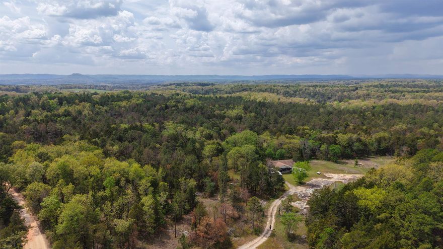 200± Acres for Sale in North Central Arkansas – Hunting Land, Caves, Waterfalls & Homesite Near White River. 200± acre property located on Old Dolph Road just outside Calico Rock in the heart of North Central Arkansas. This unique offering includes the original 36± acres with established homesite, plus additional expansive acreage ideal for hunting, recreation, or development in the beautiful Ozark Mountains. This property features county road frontage with minimal gravel access, providing both convenience and the privacy buyers are searching for. The original homesite includes well and septic already on the property, helping save time and expense for future construction. An older structure remains on-site and will need to be removed, giving you a blank canvas to design your dream home or cabin getaway. What truly sets this property apart is the natural beauty and recreational features. The additional acreage includes prime hunting land with abundant wildlife, along with three caves, scenic waterfalls, and trails throughout the property—perfect for outdoor enthusiasts, ATV riding, or exploring your own Ozark paradise. Located within 5 miles from White River.
