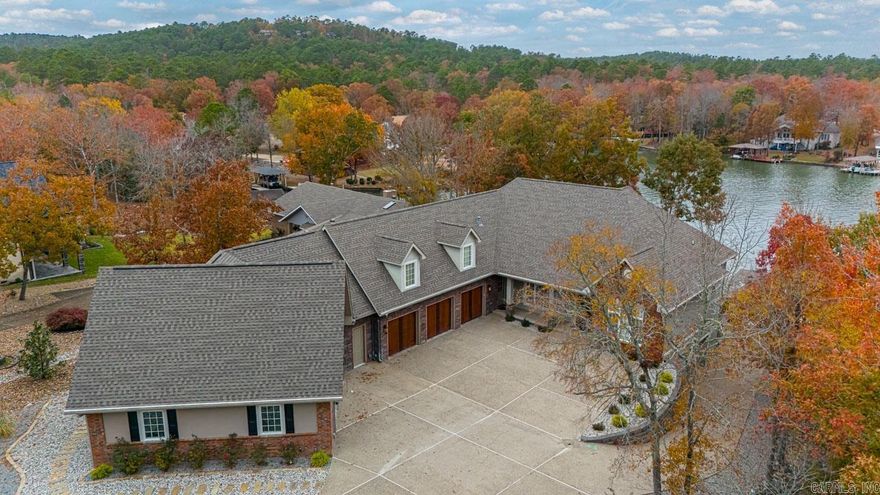 Lake Balboa Home with all the bells and whistles.  Approx. 5432 sq. ft. h/c along with 2975 feet of garage, RV Storage, Bonus Room and Shop. 6 Bedrooms or 5 if you prefer if you need an office, 4 baths. Great Room and Family Room, Reading or TV Room, Laundry Room. Maple flooring and kitchen cabinets, granite, center island with prep sink. High volume ceilings, crown molding, outdoor kitchen, boat dock and seawall.  Built in 2008, professional landscaping, geo-thermal unit with triple zones, remote blinds in great rm, kitchen, master bath, laundry. High quality construction and upgraded features.  Call Charlotte at 501-922-7050 for more information. Offering price $1,395,000