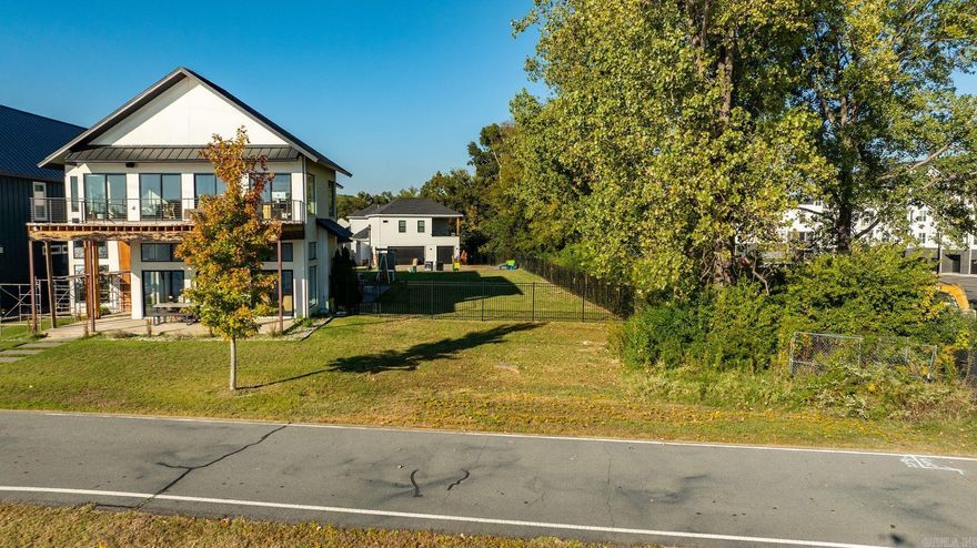 Discover a rare opportunity to own a riverfront lot with sweeping views of the Arkansas River and the downtown Little Rock Skyline. This homesite offers the perfect setting to build your custom home located in Rockwater Village, one of Central Arkansas’s most sought-after neighborhoods. This lot sits in The Residences at Rockwater, a gated neighborhood known for its classic Southern architecture, stunning views, and strong sense of community. Residents enjoy easy access to the Arkansas River Trail, downtown restaurants, and local entertainment—all within minutes of home. This property combines natural beauty, urban convenience, and timeless Southern charm.
