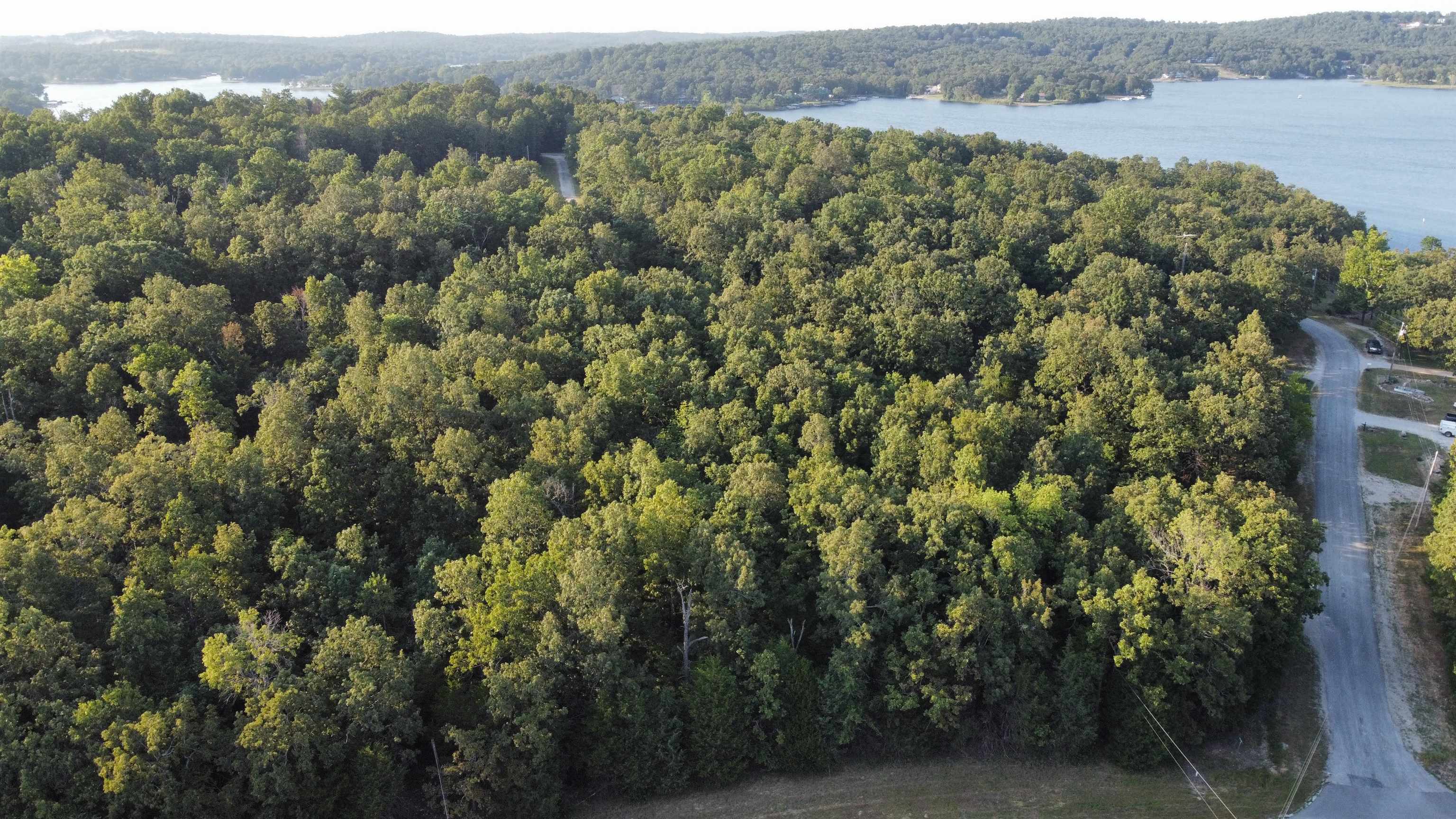 Near Crown Lake, Endless Possibility Awaits - Discover a prime homesite nestled in the scenic heart of Horseshoe Bend, Arkansas. Just moments from the sparkling waters of Crown Lake, this vacant lot offers an exceptional canvas for your dream home. Imagine peaceful lake breezes, quiet surroundings, and upscale living-all without the lakefront price. Build your legacy in a location where nature, leisure, and elegance converge.