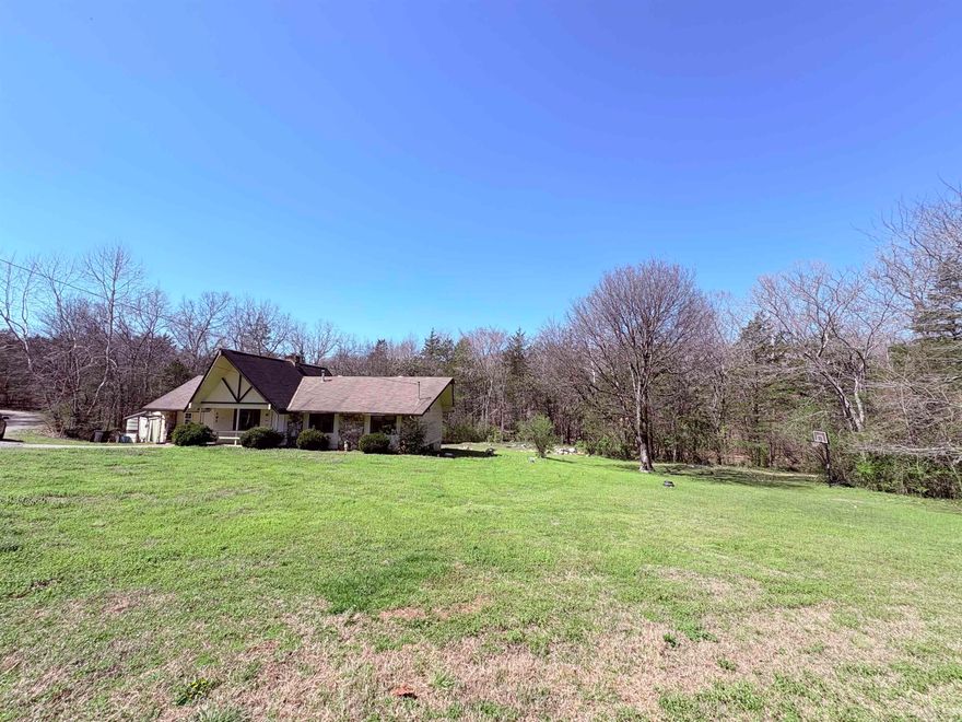 4-bedroom, 3-bath home on approximately 0.69 acres with a wet weather creek running through the backyard and a screened-in back porch overlooking the peaceful setting. This one-level property features a gas log fireplace and a spacious yard with plenty of room to enjoy outdoor living. Located less than a mile from the North Golf Course and the South Fork River, offering easy access to kayaking, canoeing, fishing, and floating. This home is in need of significant updates and repairs, making it ideal for buyers looking for a project or an opportunity to renovate and build equity. With its size, layout, and desirable location, this property has strong potential to be transformed into a beautiful home with the right vision.