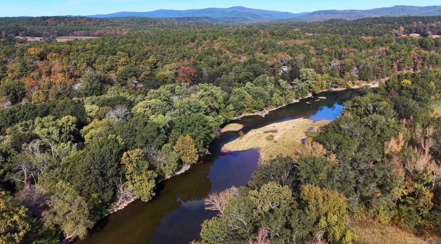 Imagine waking each morning to sweeping Ouachita River views, coffee in hand as birds fill the forest and the river flows below. Tucked between the river and Ouachita National Forest, this rare property offers privacy, natural beauty, and income potential. Featuring ~1,000 feet of improved river frontage, the property includes FIVE homes (four furnished), campground facilities, docks, and established infrastructure. -MAIN HOUSE offers 5 beds, 2.5 baths, and ~3,660 sq ft across four levels with stunning river views, a chef’s kitchen with live-edge pecan island, and a 1,300 sq ft deck. The walk-out basement is partially finished with materials on-site to complete. -FOUR ADDITIONAL HOUSES provide turnkey guest or rental opportunities. The property also includes 14 primitive campsites, 2 RV sites, bathhouse, docks, and kayaks/canoes. Three wells, four septic systems, irrigation, garden, and outbuildings support sustainable living. Operated as a successful riverfront retreat for nearly 30 years, this is a rare opportunity for income, family compound, or private escape.