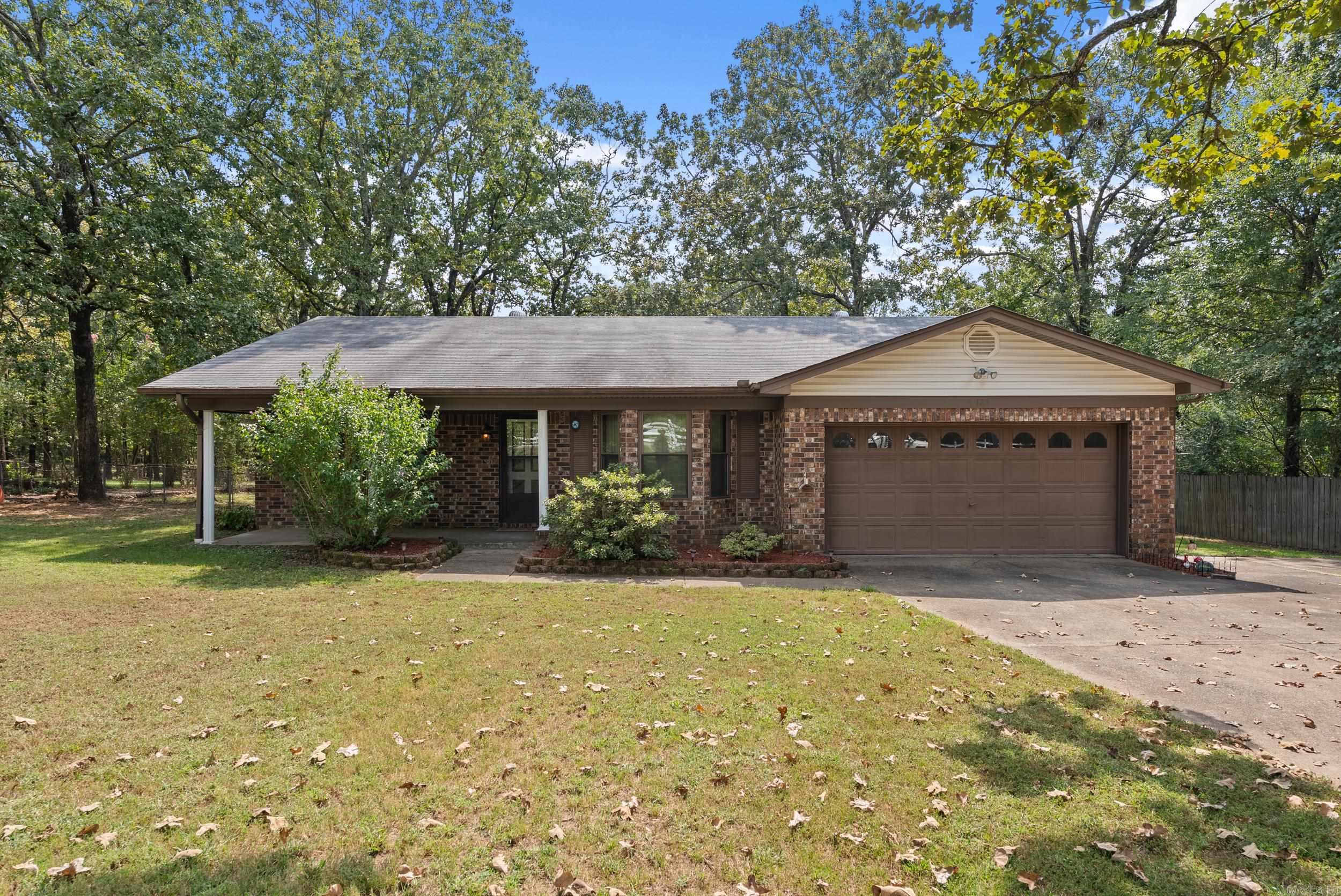 Welcome to this well-built and meticulously maintained one-owner brick home, located on a peaceful street in Cabot. Built in 1987, this charming 3-bedroom, 2-bath home sits on a spacious 1.01-acre lot with a fully fenced backyard and wooded views for added privacy. Inside, you'll find a cozy living area featuring a beautiful wood-burning fireplace with a blower, perfect for cooler evenings. The home offers plenty of storage throughout, including additional space in the garage and an insulated shop out back—ideal for hobbies or extra storage. Major updates include a new HVAC system and water heater in 2020, garbage disposal in 2022, and a freshly built deck in 2023. The septic system was pumped in 2020, offering peace of mind for the new owner. This home combines comfort, functionality, and serene surroundings—don’t miss your chance to make it yours!