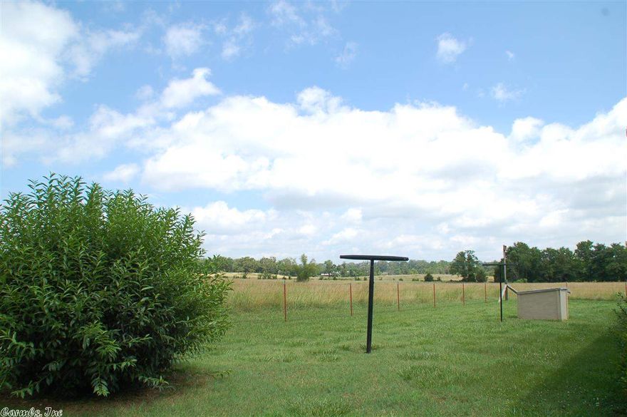 123 Acres of Gorgeous farmland with a beautiful brick home.  The land is wooded in a few areas but consist of mostly pasture.  Carter Creek runs through the property and there is also a pecan orchard.  The 3bd2 ba home has a porch in the front and a deck in the back that provides a beautiful view of the pasture.