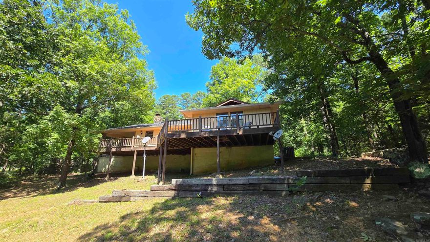 Welcome to market this Charming 3-bedroom, 2-bath home located on a secluded road in Fairfield Bay. Enjoy peace and privacy with a large back deck perfect for relaxing or entertaining. With a little tree trimming, you can open up a beautiful mountain view. The home features a new roof, updated water heater, and flooring. This also includes access to all the incredible amenities Fairfield Bay has to offer Greers Ferry lake, marina, golf courses, mini golf, 3 community pools, pickle ball court, hiking trails, ATV Trails, and more. A great opportunity for a full-time residence, vacation getaway, or investment property! Call today for your private tour. The lot next door that goes with this sale can be surveyed & replat into the lot that the home sits on.  It also contains the lot behind the home.  2 have been replat to 1.   The 3rd lot was purchased later.  All can become 1. No sewer here, monthly costs are much lower since its on septic.