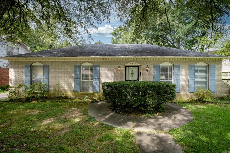 Darling one-level brick home on flat lot in quiet neighborhood. Open floorplan with lots of light. Updated kitchen with cool backsplash and nice appliances. Two car rear carport with plenty of storage and work space.  Beautiful lot across from park access. Neat as a pin and super cute!!