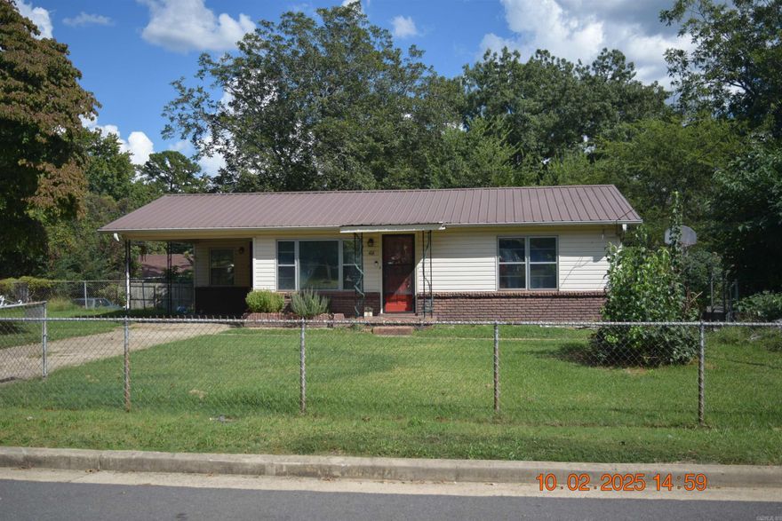 Step inside this 2-bedroom, 1-bath residence and you’ll immediately notice the warmth of hardwood floors complemented by durable tile. With approximately 952 square feet of living space, this home strikes the perfect balance between cozy comfort and easy upkeep.  Out back, a fully fenced yard stretches across the lot, providing ample room for entertaining or a flourishing garden. The detached storage building—already wired with electricity—adds flexibility for hobbies, a workshop, or simply keeping your belongings neatly tucked away.  Practical updates bring peace of mind, while central heating and cooling ensure year-round comfort. The backyard offers endless opportunities for outdoor living—whether it’s morning coffee on the patio or weekend barbecues.  This home combines efficiency, charm, and a generous outdoor space in a way that’s rarely found at this price point. It’s move-in ready, waiting for you to add your personal touch and start the next chapter.