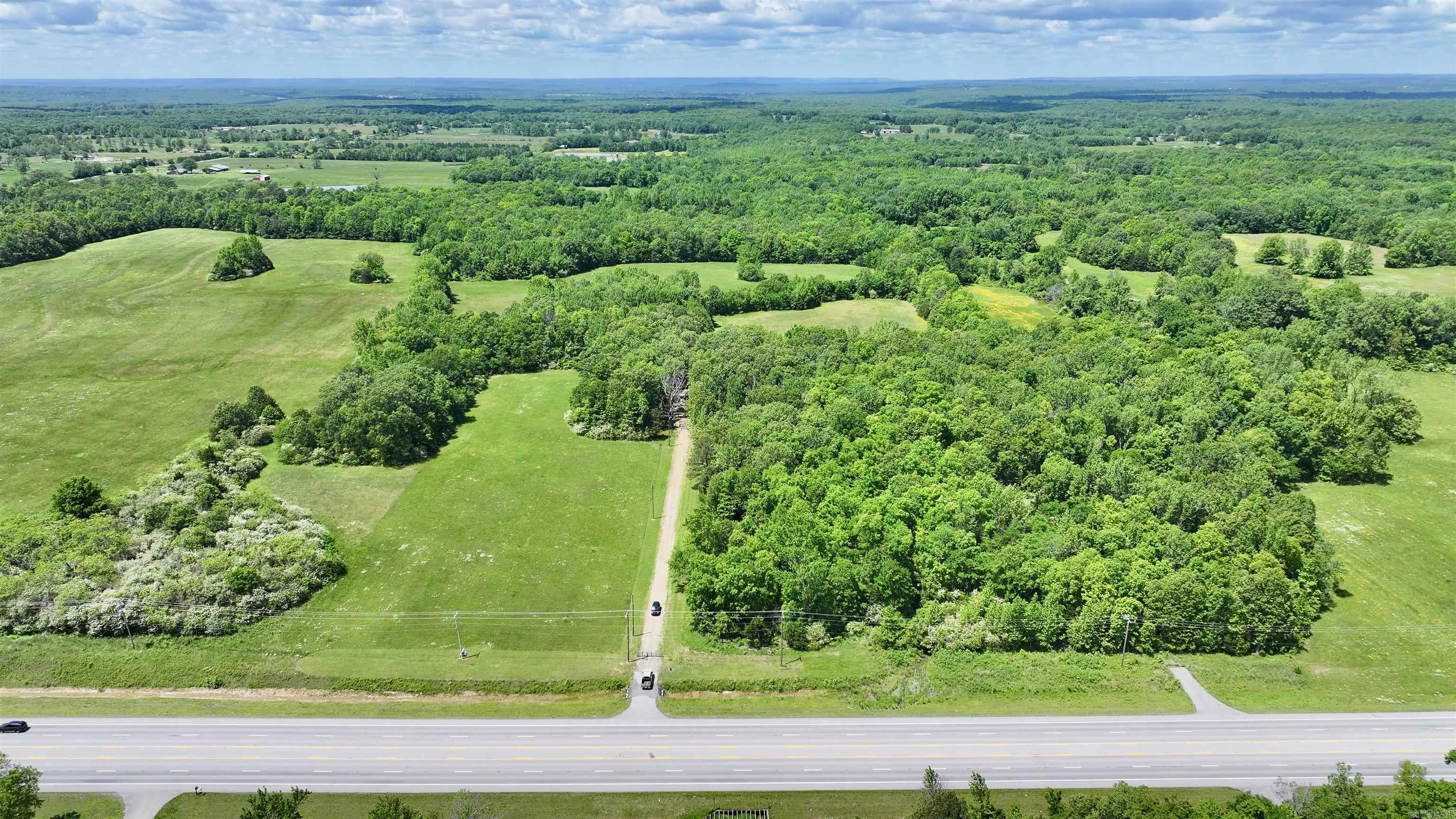 Looking for the perfect spot to build? How about some hunting land? Or maybe you'd like some acreage with income producing hay? If so, then this is the perfect spot for you. This 31.46 acres has plenty of pasture and plenty of woods to hunt. There is also a pond on the property. There is approximately 210ft of highway frontage on Hwy 167. Mobile homes are allowed, and there are no restrictions. Plenty of room for horses, cows, chicken, goats, or anything else that your heart desires.