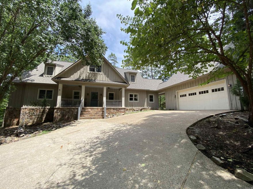 You will love the layout of this Harbor South home at Mountain Harbor Resort. It is perfect for family gatherings and entertaining! 5 Bedrooms, 4 1/2 baths, approx. 3,006 sq ft in the home AND a bonus room and bath, approx. 448 sq ft, located above the garage that could be used for a 6th bedroom or as a hangout for the kids.  Primary bedroom is located on the main floor and the living area, kitchen and dining room are all combined so that everyone is included in the fun. French doors open to a wonderful sunroom that runs along the back of the home with views of the small lake located in the Harbor South Park.  Large rock firepit is steps away from the sunroom door. Need an office to work remotely? This home has an office just inside the main entrance or it could be used as another bedroom.  Down the hill is a second 26' x 28' garage with front & back garage doors as well as an entrance door.  This home is a must see!  Lots of space for family & friends, 2 garages for storing the necessary lake things, 20 kw home generator, fire pit, sunroom, 1.46 acres AND a hassle-free walk to the Harbor South Park swimming pool.  What are you waiting for, call today for your private showing!