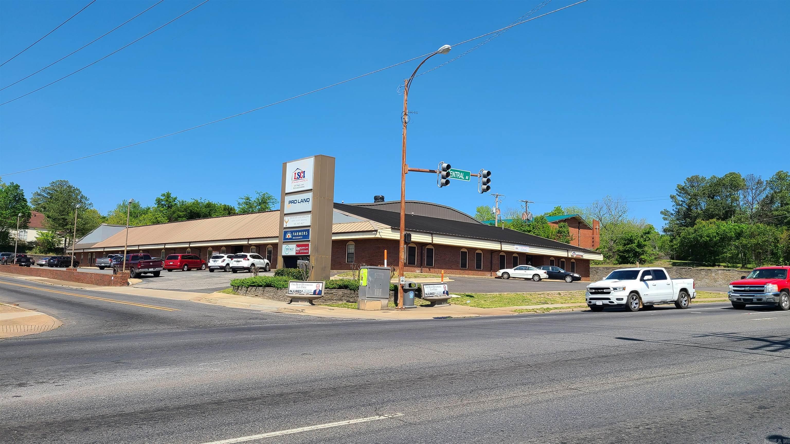 Large Professional Center easy to locate at stoplight intersection. Lease includes all utilities (except phone/data). rear building entrance approx. 10+/- parking spaces, main entry area with 3 private offices. Multiple Tenants share common areas both inside and out.