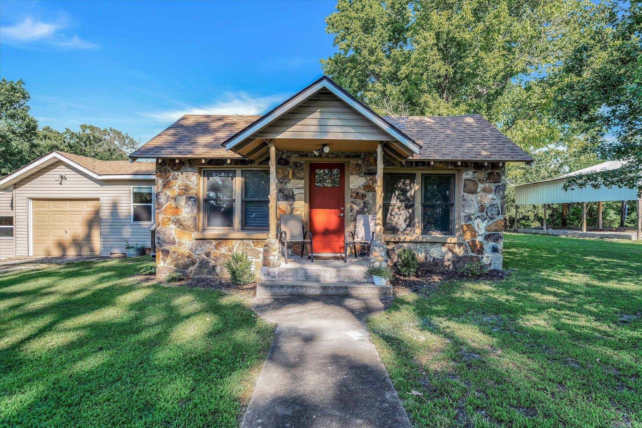 Tucked away on sought-after Crystal Cove Roadājust a mile from the resort and public boat launchā209 CR 832 in Henderson is the ultimate Norfork Lake weekenderās dream! This 1.5-acre, unrestricted property offers privacy, charm, and quick lake access. The main home features 2 bedrooms and an oversized bathroom with a double vanity, separate shower, and soaking tub. A third bedroom with its own private entrance and en suite half bath is perfect for guests or a bunkroom setup. Youāll love the updated flooring, cozy green kitchen with gas range, and the inviting stone exterior. With a private well, septic system, NAEC electric, and Next Fiber Internet, this spot has all the comforts of home wrapped in a weekend getaway vibe. Pack your rods, load the cooler, and donāt miss this oneāitās lake life made easy!