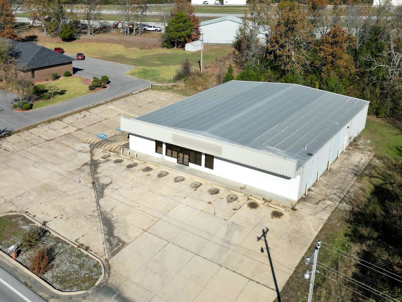 Built in 2001, the property is offered significantly below replacement cost and offers an exceptional owner/user investment opportunity. Comprised of a single story, heated and cooled, detached metal building totaling 8000 square feet +/- and is positioned on 1.19 acre +/- of land, which backs up to the airport. Formerly occupied by Dollar General, this property offers 30 surface parking spaces and is easily accessible and visible located right in the heart of Horseshoe Bend. Call today!
