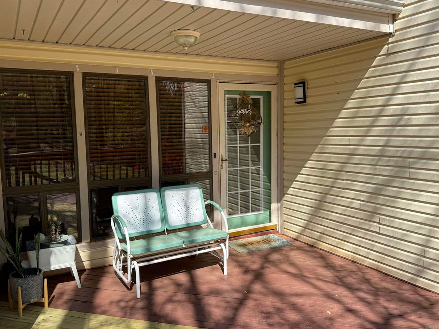 Lovely ONE-level, spacious condo is an end unit.  Tasteful interior colors,  wood & Carpet, vinyl & laminate flooring, energy efficient windows & exterior doors.  2 large BR, 2 full Baths, one with walk-in shower One BR has large cedar closet.  Excellent furniture is included.  Bright kitchen.  All appliances are included  Permanent entry cover.  Expanded deck looks into wooded area, and during wet weather, you can hear the creek behind! In the crawlspace is an enclosed shop/storage room.    Complex has a metal roof (2013). This unit has 2 covered parking spaces right in front of the walkway to the front door!  Carefree & classy living. One of the best units!  Don't miss this one!