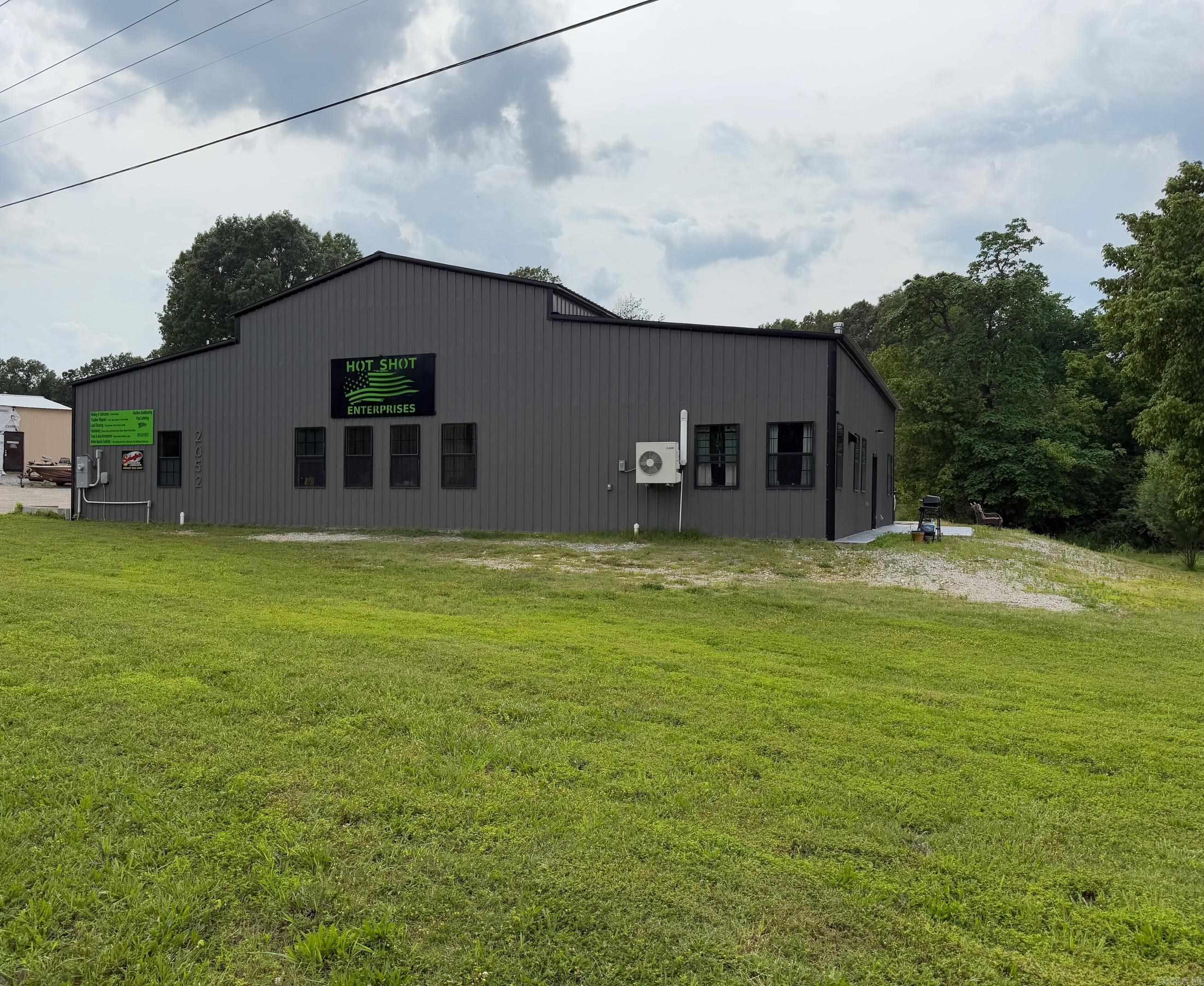 Multi purpose commercial building with highway frontage, along Hwy 178, also known as Central Blvd. Approximately 3500 square feet that contains a 1000 square foot retail/office area, 1500 square foot shop with 18'overhead door and approximately 1100 square feet (including upstairs) of living quarters that has been immaculately designed. The newly constructed all steel building has been sprayed foamed for energy efficiency and has a tankless heated water system. Property has a large area for parking. Additional lots adjacent to this property are available for purchase for expansion. RV pad and hookup. Minutes from Bull Shoals Marina and White River. Would make a perfect Vacation rental with the ability to finish out retail area like the existing living quarters. Business is also for sale. Create a business of your dreams in the beautiful Ozarks.