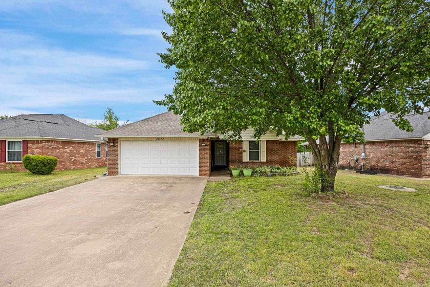 Step inside this beautifully designed brick home featuring 3 bedrooms and 2 bathrooms, with modern touches throughout, located in a wonderful subdivision. This home offers a spacious 2-car garage, a large patio perfect for family gatherings, custom-made kitchen cabinets, and sleek tile flooring.  As a bonus, there’s an additional outbuilding—ideal for extra storage, a workshop, or even a creative studio space!