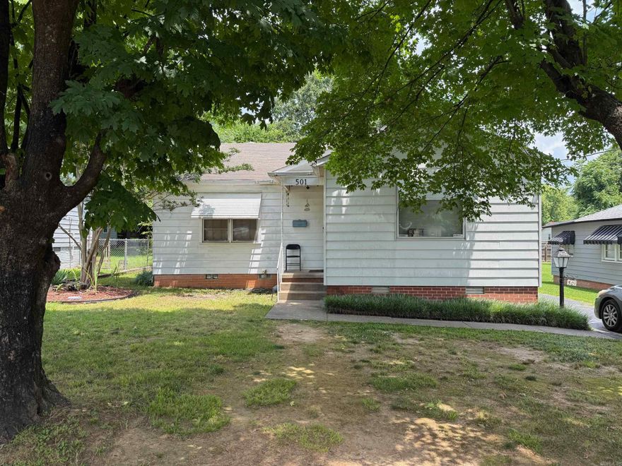QUIT PAYING RENT !!  Cute starter home with 3 bedrooms and 2 1/2 baths. Owner added some nice touches.  Kitchen has granite countertops, stainless gas stove, and dishwasher, nice light fixtures throughout, and new flooring all added 2020.  Covered carport, and detached garage.  Agents please see remarks for showing instructions.