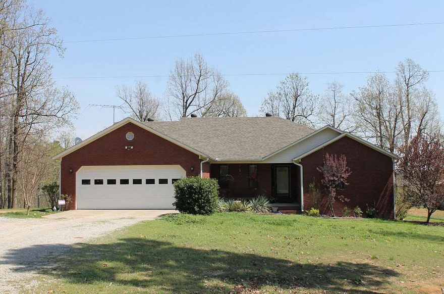 Hunting enthusiasts ... looking for a wonderful home with amenities and space from neighbors?  This 4 bedroom/2 bath home has an open floor plan with split bedrooms.  Great room has fireplace and master suite is complete with jetted tub and separate shower. Back deck overlooks pasture and woods and side of property borders Scatter Creek!  There is also a 2-stall barn/shop plus storage building.  Seller is offering $1500 flooring allowance and 1-yr home warranty.  Call today for your personal tour!