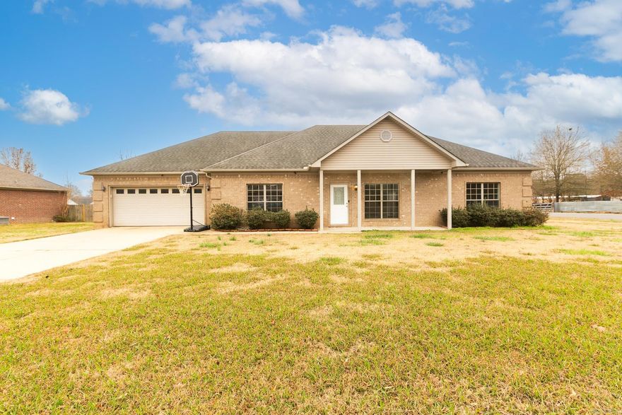 Nice brick 4 BR 2 BA plus office. This open has large rooms with split floor plan, wood floors, both bathrooms have double vanities, huge covered deck and fenced back yard. New carpet 2025, New HVAC 2023, 50 amp power in garage. This home is ready for a new family. Call for your showing today!