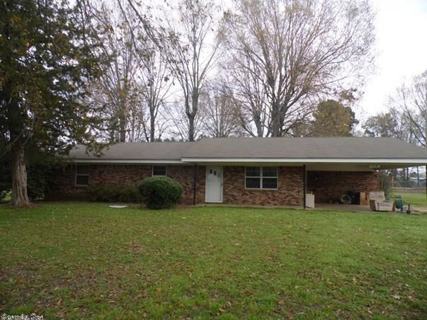 Large yard, storage buildings close to town.
