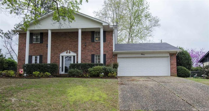 Welcome home!  Park Hill area with updates: Colonial style 3 bedroom 2 and a half bath home.  Features a formal living area (could be used as a kid play area), living room has wood fireplace, dining room, kitchen overlooking the back yard, laundry, with tiled shower/tubs, master bedroom has his/her closets, built in desk and extra storage/work area in the garage.  Easy access to downtown North Little Rock and Little Rock. Check out the Video tour, click on the virtual tour link.