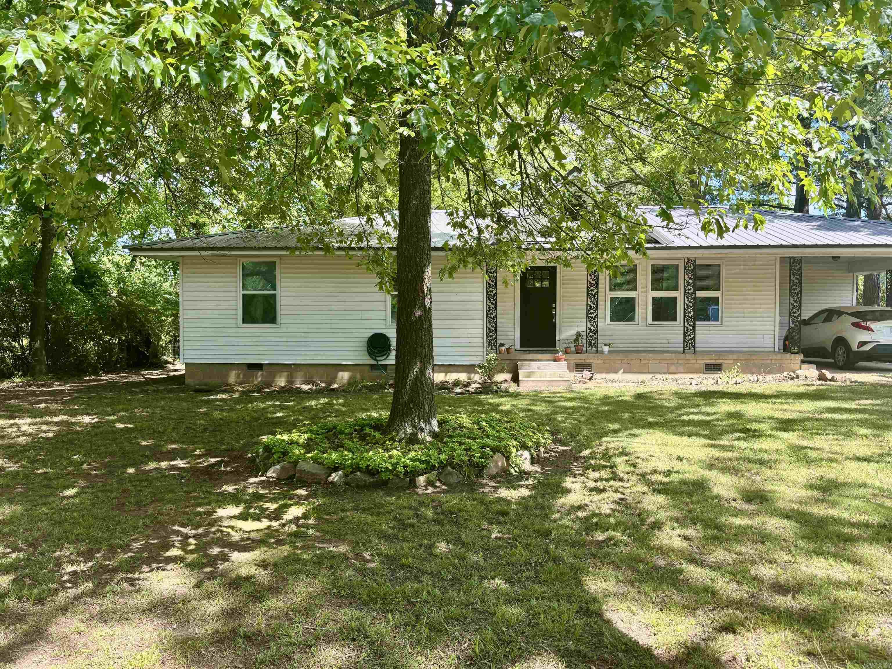 This charming 3br/1ba farmhouse has been completely updated. As you walk in to the open concept living and kitchen area, you are greeted with such a cozy feel. The seller has added built in shelving in the kitchen and dining area. They have utilized every space from the pull out microwave in the breakfast bar to the extra storage around the backside of the bar. Extra care has been given in the design of the bathroom with the walk in shower and the soaker tub. This home sits on an acre that is less than a mile from the highway, and just right down the road from the grocery store. It has a great country feel, but minutes from everything. It sits on an acre of land that allows for room to put in that garden you have been planning. The back deck leaves plenty of space and built in seating to entertain during cookouts. Don’t let this gem get away. New metal roof, hot water heater, hvac unit all in 2019 along with the complete udates. Beautiful kitchen appliances that include a Thor counter top gas range, and a brand new refrigerator that will also convey.
