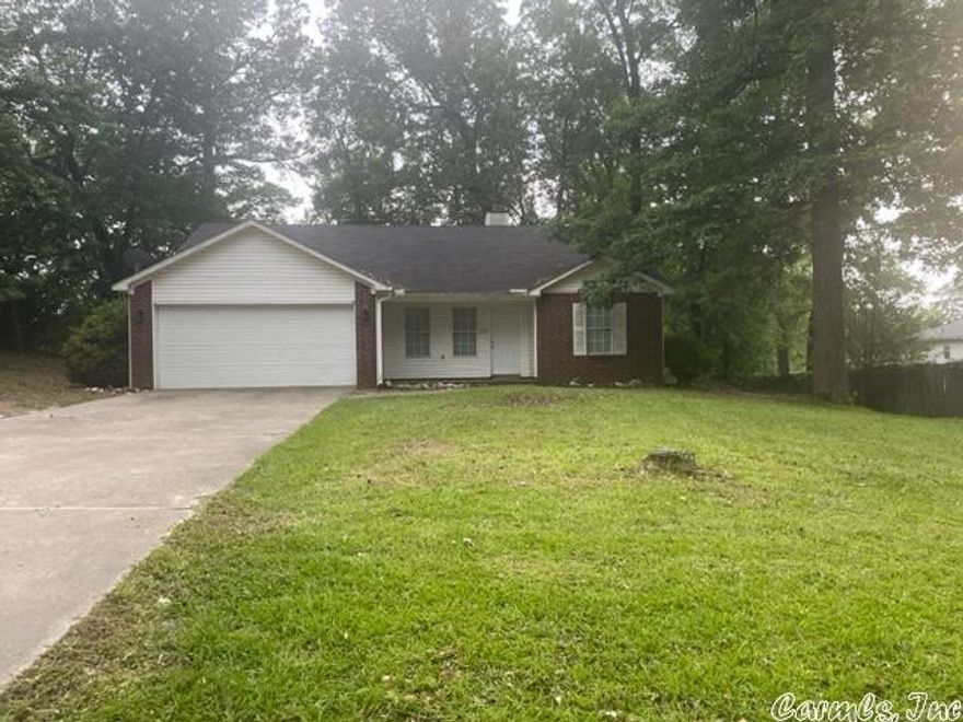 This home is a beautiful well-maintained one level home in Bryant School District. It has vaulted ceilings with a corner fireplace in the living room. The kitchen features newer appliances with a small breakfast bar as well as a dining area.  The primary bedroom has a large bathroom with two walk-in closets. The other 2 bedrooms share a bathroom on the opposite side of the house from the primary. You'll love the huge, level fenced backyard. Updates include CH/A and wood floors throughout the home.  This property is almost a half-acre lot in town and conveniently located to shopping and the interstate.   Call today for your appointment!