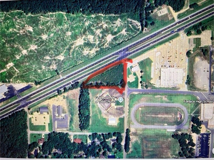 Prime corner property located on a high traffic for lane. Located beside Wal Mart and Fordyce Bank & Trust Branch.  Located in front of First Assembly Of God Church.