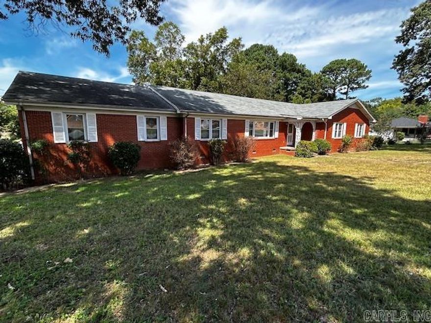 ARE YOU WILLING to do some ''HOME'' work? With over 2600 SQUARE FEET of space, use your imagination and some sweat equity to reward yourself with a DREAM HOME! Formal living and dining room combination provides a generous amount of space to ENTERTAIN. Spacious family room is PERFECT for informal gatherings with a central fireplace and built ins. LATE FOR WORK? Not in this house! Each bathroom provides AMPLE space for everyone to get ready during busy mornings along with an incredible amount of STORAGE. Use your IMAGINATION and bring this beauty located on a SPACIOUS corner lot near Lyon College back to life! THE POSSIBILITES ARE GRAND!