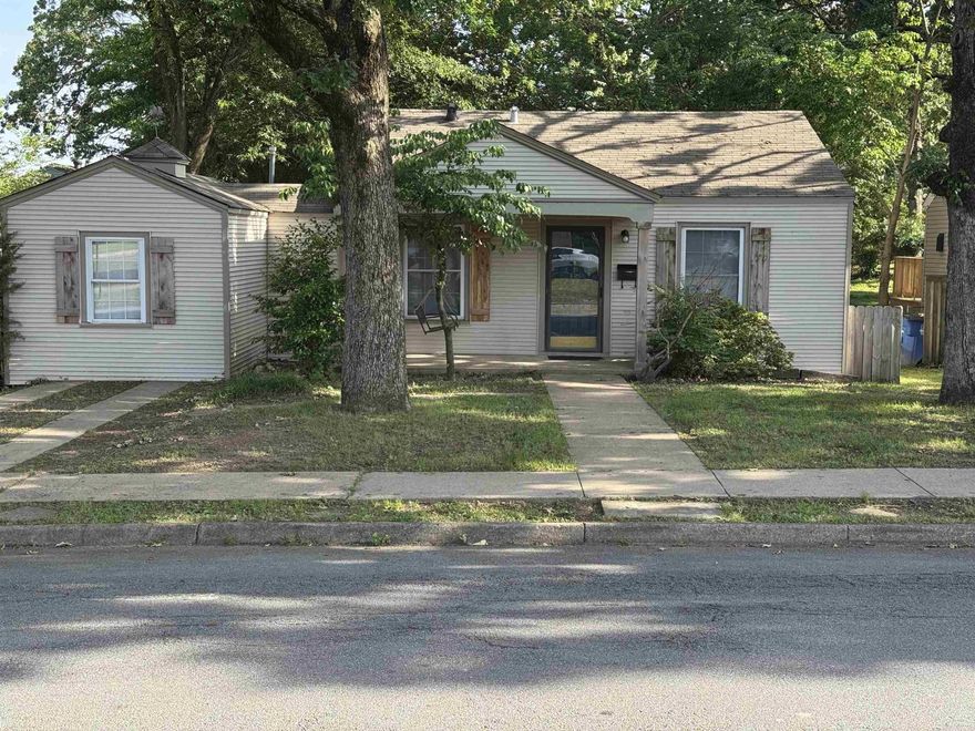 112 W H Avenue in North Little Rock, Arkansas, is a charming single-family home nestled in the historic Park Hill district. Built in 1950, this traditional bungalow-style residence offers 1,030 square feet of living space with 3 bedrooms and 1 bathroom. The home has been recently updated, featuring new flooring, fresh paint, granite kitchen countertops, and modern kitchen appliances. The spacious backyard includes a deck, perfect for relaxing or entertaining guests. Inside, you'll find an eat-in kitchen, a cozy dining area, and luxury vinyl flooring throughout. See agent remarks. Seller agrees to pay up to $2500.00 in closing cost.