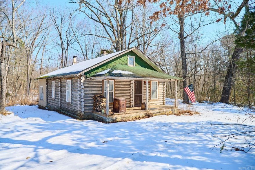 Step back in time without giving up modern comfort in this beautifully preserved 1908 log cabin set on 13 surveyed acres. Rich with character and craftsmanship, this historic home blends rustic charm with thoughtful updates, including HVAC, double-pane windows, added insulation, and a water softener—making year-round living comfortable and efficient.A cozy wood stove anchors the cabin, perfect for crisp evenings and adding to the authentic cabin feel. The land is a true highlight, featuring a seasonally wet pond that attracts wildlife and enhances the natural setting. Outside, the property is well-equipped for work, storage, or hobbies with multiple outbuildings and an impressive 18' x 45' RV storage building, ideal for RVs, boats, or equipment.