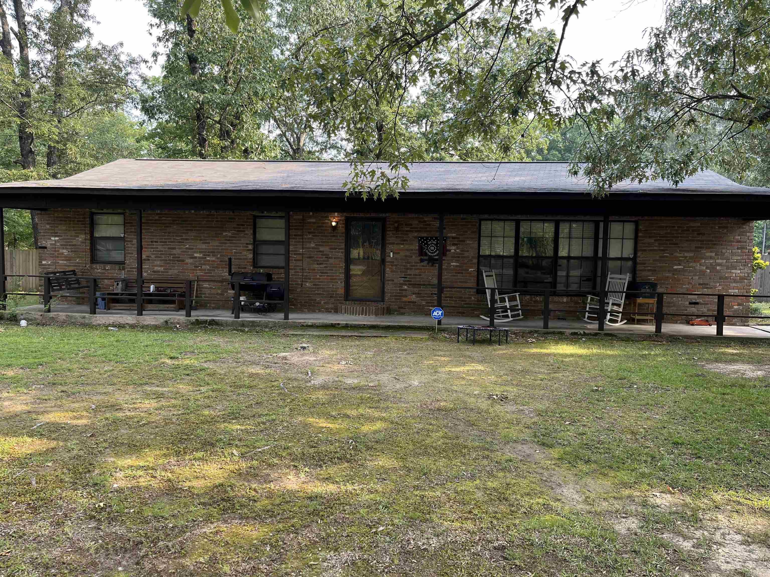 This well maintained brick home has it all! White Hall Schools, not one, but TWO SHOPS!! It also features many unique details such as a huge breakfast bar with storage, a hidden pantry in the kitchen, and extra built-ins in 2 of the bedrooms for use as an office, crafts or just tons of storage! This 3 bedroom, 2 bath home has a bonus room currently being used as a craft room, but was originally a 4th bedroom and could easily be converted back! The side entrance has room for an entry bench and leads into an oversized utility room. The huge corner lot has mature oaks and is peaceful living all within the White Hall city limits. The privacy fenced back yard has two (yes I said two!!) shops with roll up doors; 12x20 and 18x27 that both have electricity and the larger one is on a concrete slab. The back yard has a chicken coop ready for some hens, a separate fenced in raised bed garden, large concrete patio for outdoor fun and there is still plenty of room on this half acre lot! HVAC 2022, Roof 2019!!