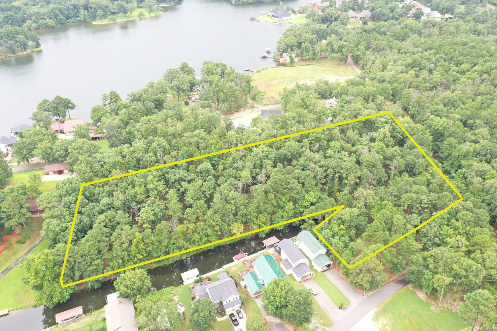 Bring your house plans and your builder!! This 4.36 acres is located on beautiful Lake Hamilton and in an area of higher end homes. This lot offers a rare 579 feet of beautiful shoreline on Lake Hamilton. Located in award winning Lakeside School district.