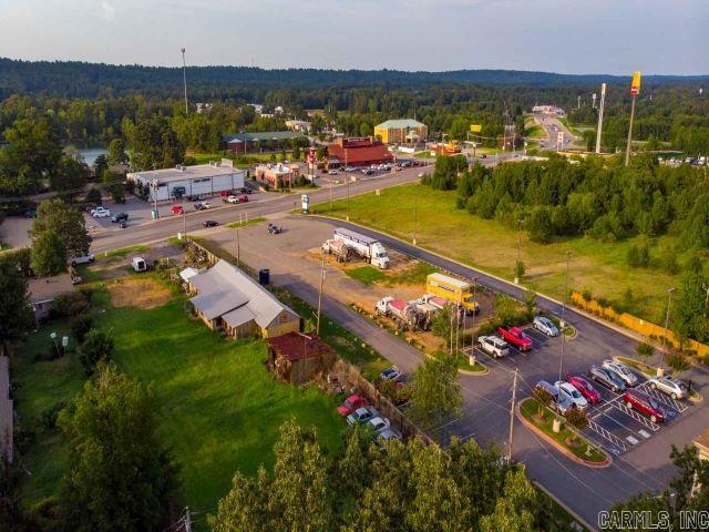 Morgan/Maumelle exit! Two parcels equal 5.05 Acres+-Located just off I-40 and Maumelle Blvd. This developing & expanding area has so much to offer. Ideal for new restaurant, retail, office building. High traffic & visibility. Check out the virtual tour link. So many possibilities. Building conveys @ no value.