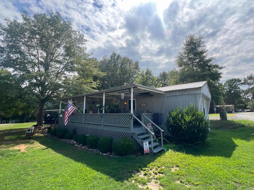 Discover this 2-bedroom, 2-bath mobile home located on Lot 36 at 228 Fishing Village Road. Perfectly situated with beautiful views of Lake Ouachita, this property offers the ideal blend of comfort and lake living. Enjoy relaxing mornings and evenings on the covered front and back patios, or take advantage of the available boat slips for endless days on the water. A handy storage building is included for all your lake gear and outdoor essentials. Whether it’s fishing, boating, swimming, or simply soaking up the scenery, this property provides year-round access to everything Lake Ouachita has to offer.
