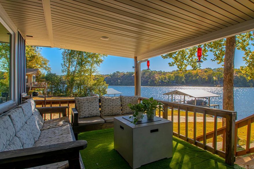 Discover your dream home with breathtaking views on just over 1 acre in this recently renovated 5-bedroom, 4-bathroom oasis. The expansive back deck, stretching the entire length of the home, invites you to relax and enjoy panoramic lake views. With approximately 1,000 sq. ft. added, this spacious residence boasts modern finishes throughout.  The property features a heated and cooled garage, ideal for year-round comfort, along with a versatile shop/office space. A brand-new roof installed in 2024 ensures peace of mind.  Enjoy shared access to a driveway and boat launch, plus your own private two-boat dock and party dock—perfect for waterfront entertaining. Don’t miss this opportunity to own a piece of paradise on Lake Catherine!